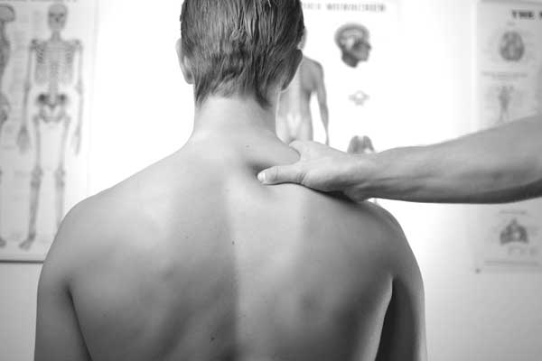 A man getting treated for neck pain