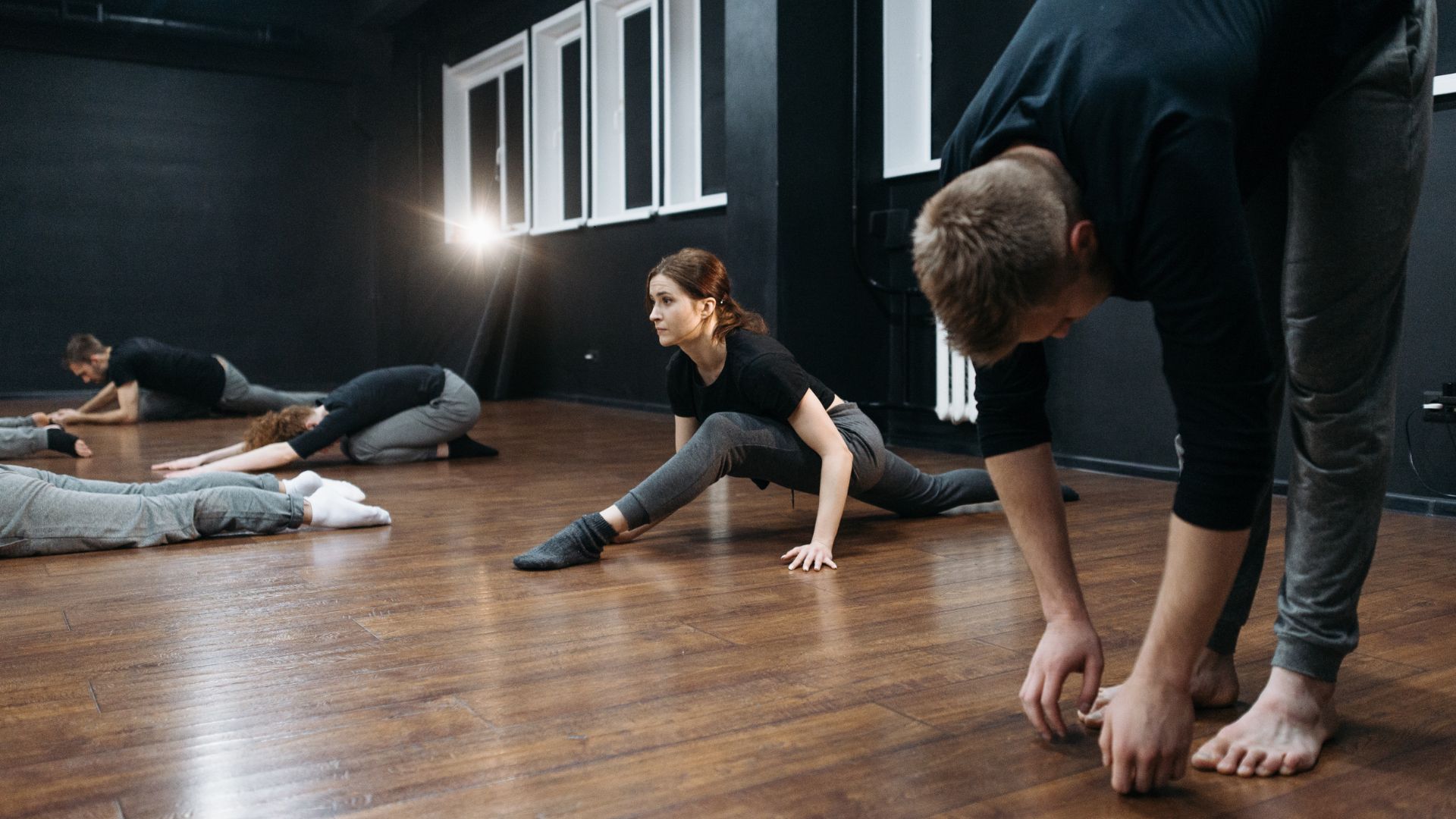 group of dancers warming up before class