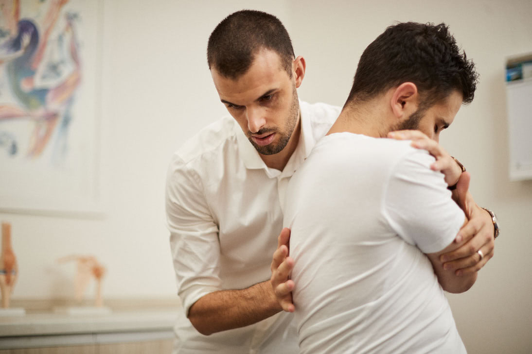 Physiotherapist treating the patient in the clinic