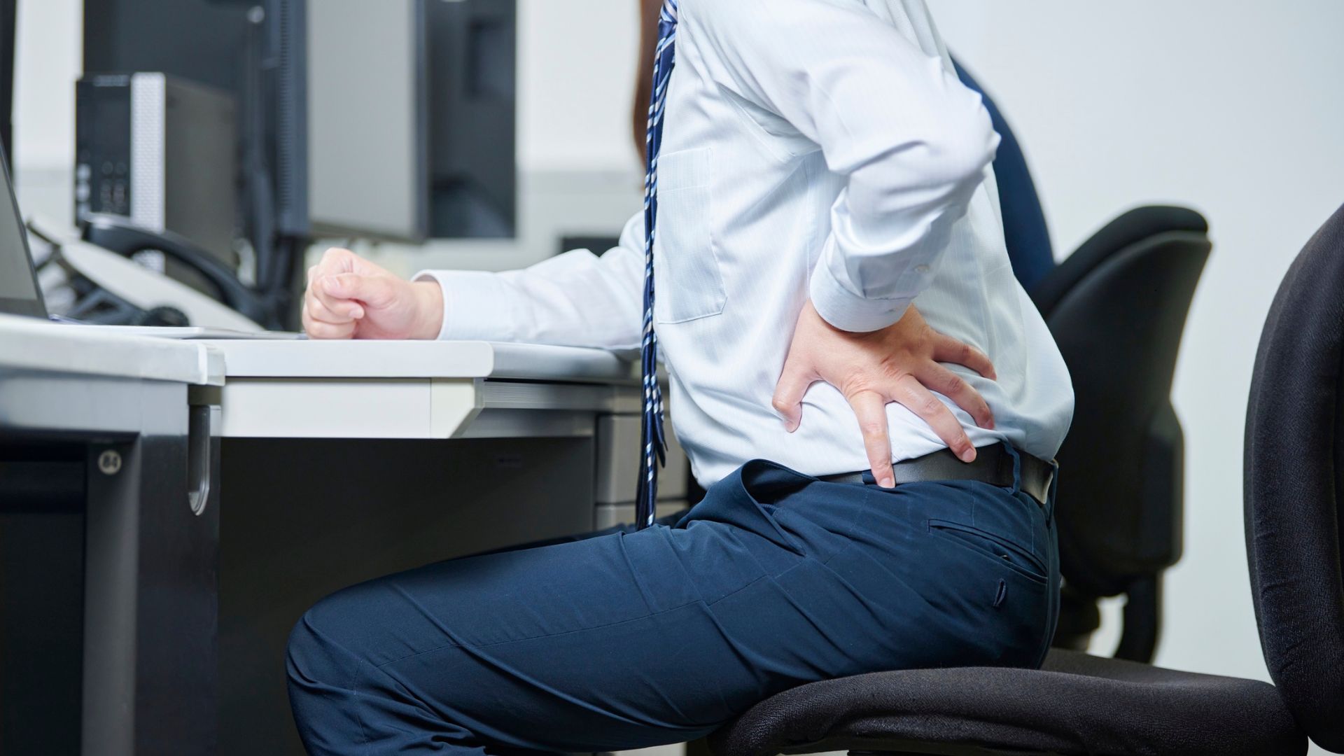 recurring back pain when sitting at desk 