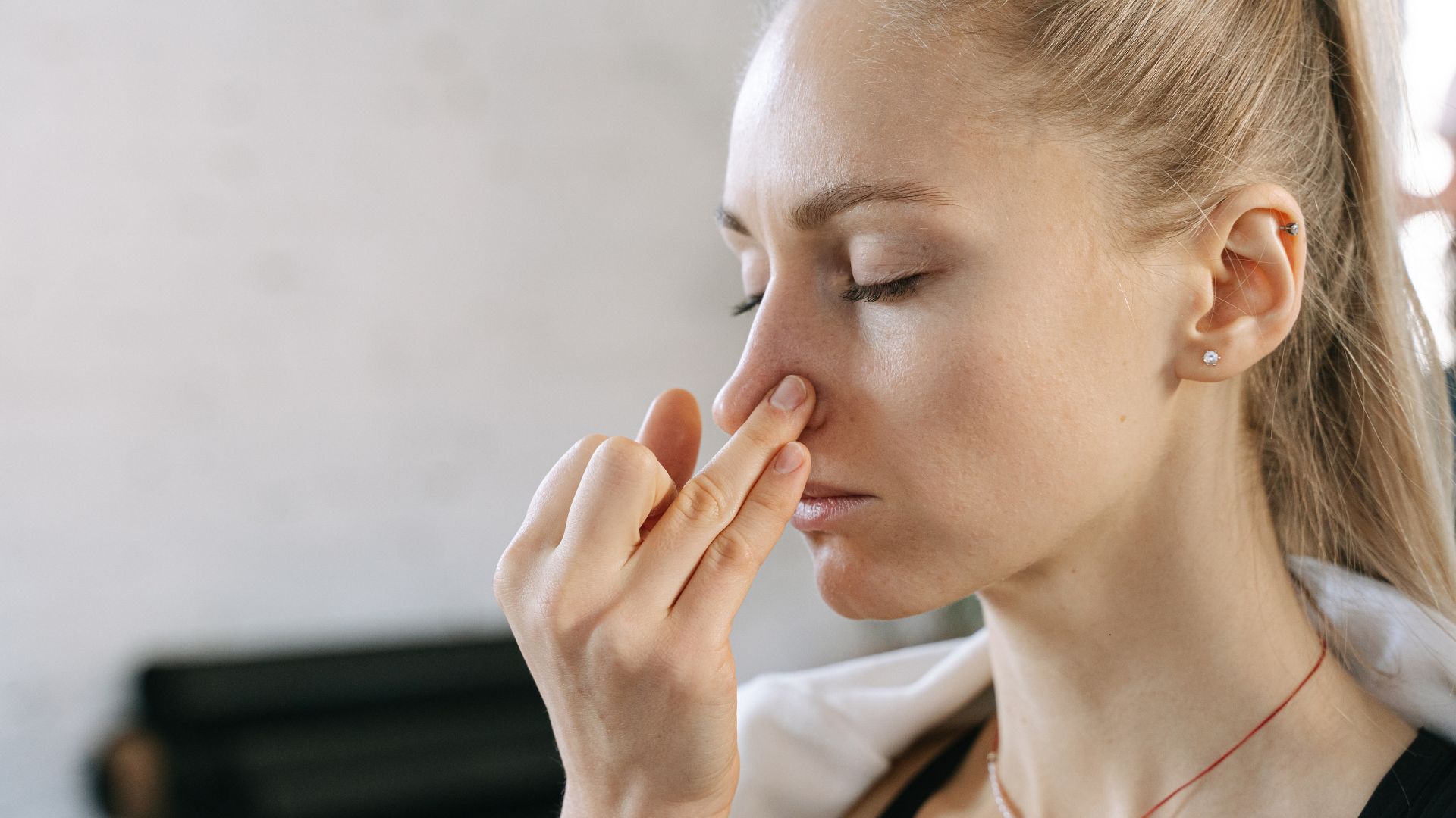 woman performing breathing techniques