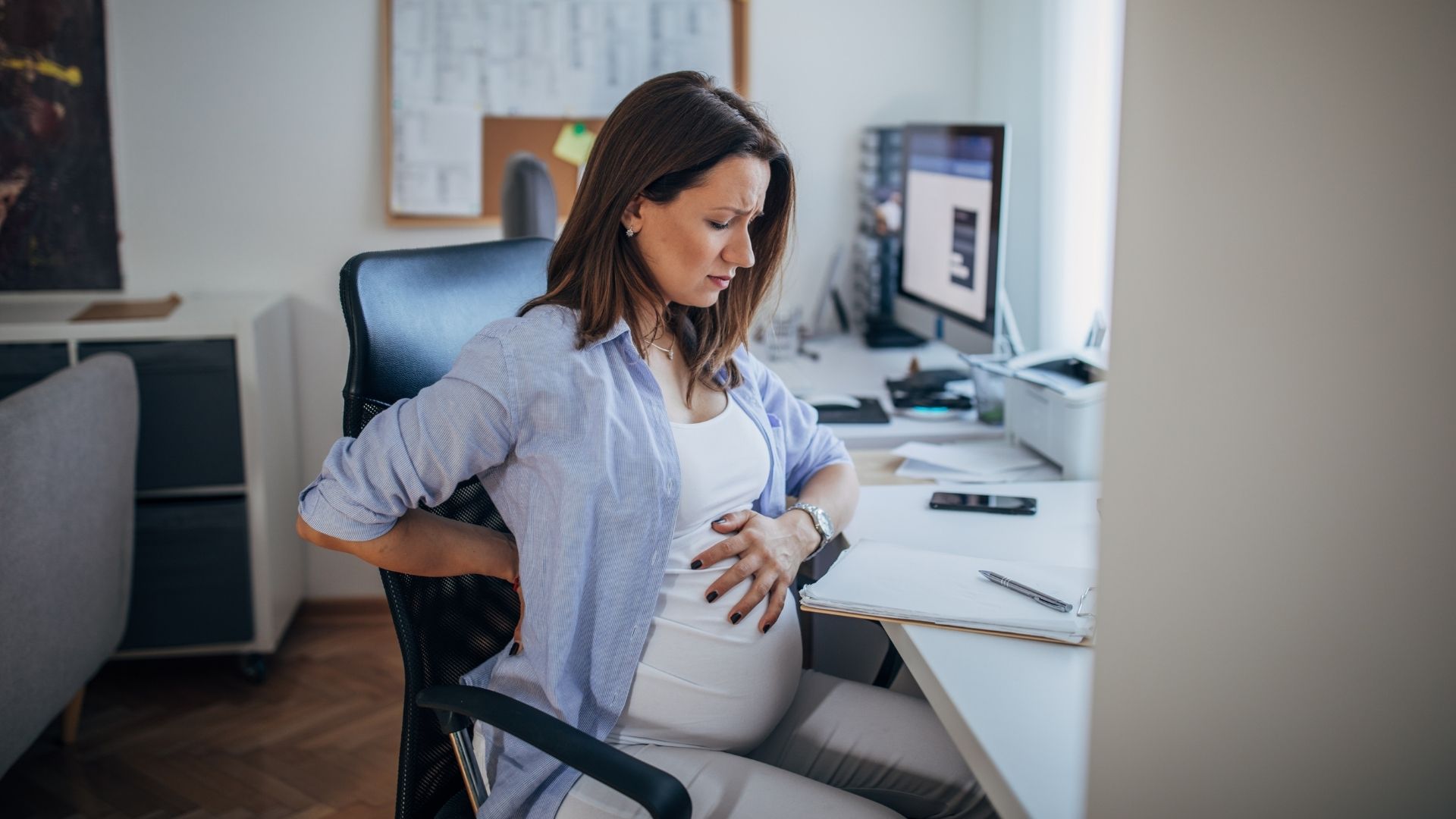 pregnant woman struggling with back pain